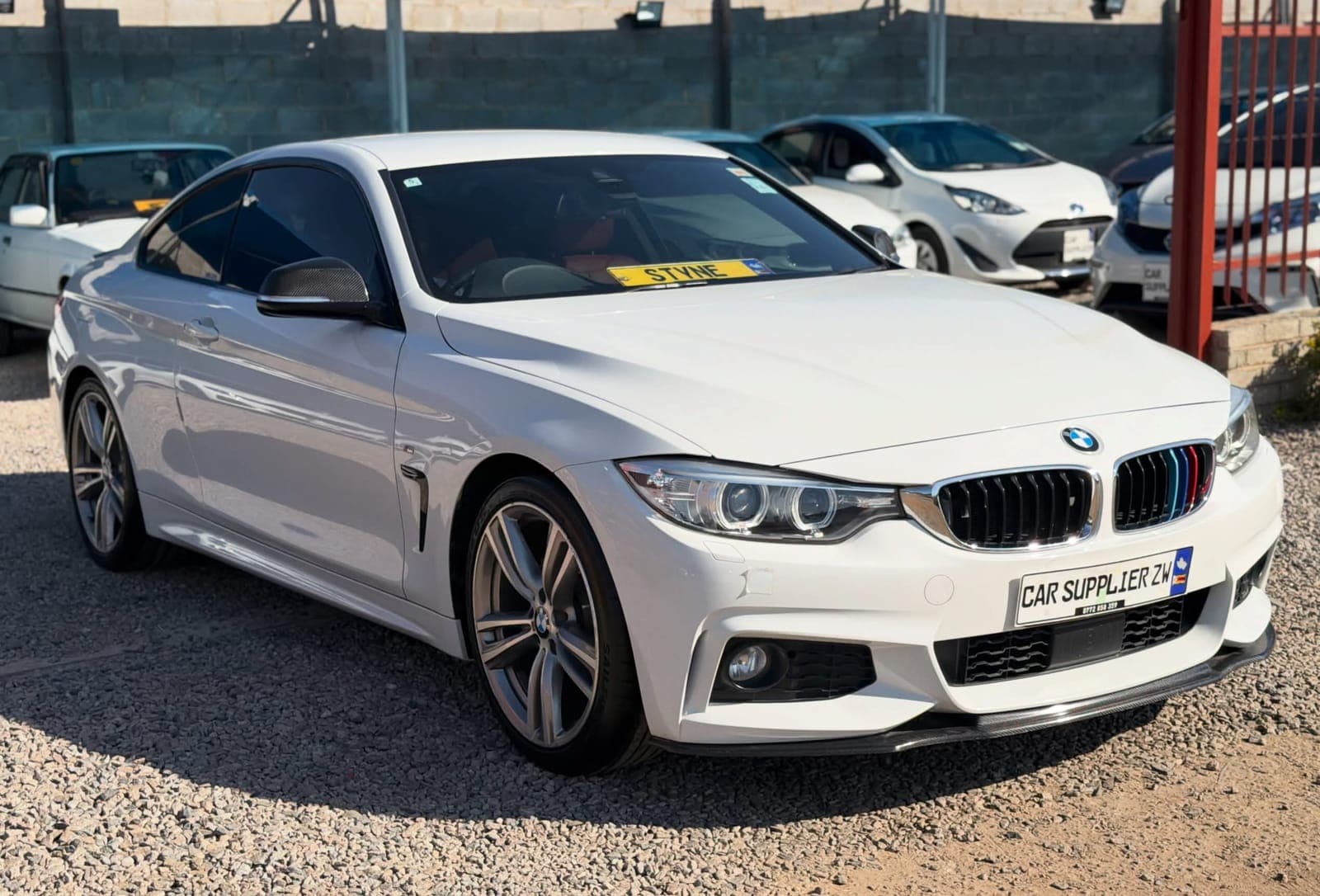 White BMW F32 420i coupé at Car Supplier Zimbabwe